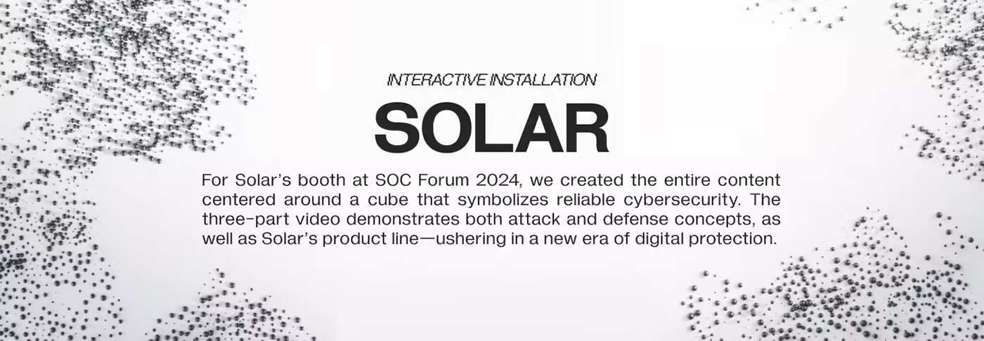 Text describing SOLAR interactive cube installation with attack-defense video sequence.